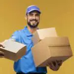delivery guy in light blue passing a box - delivery scheduling software