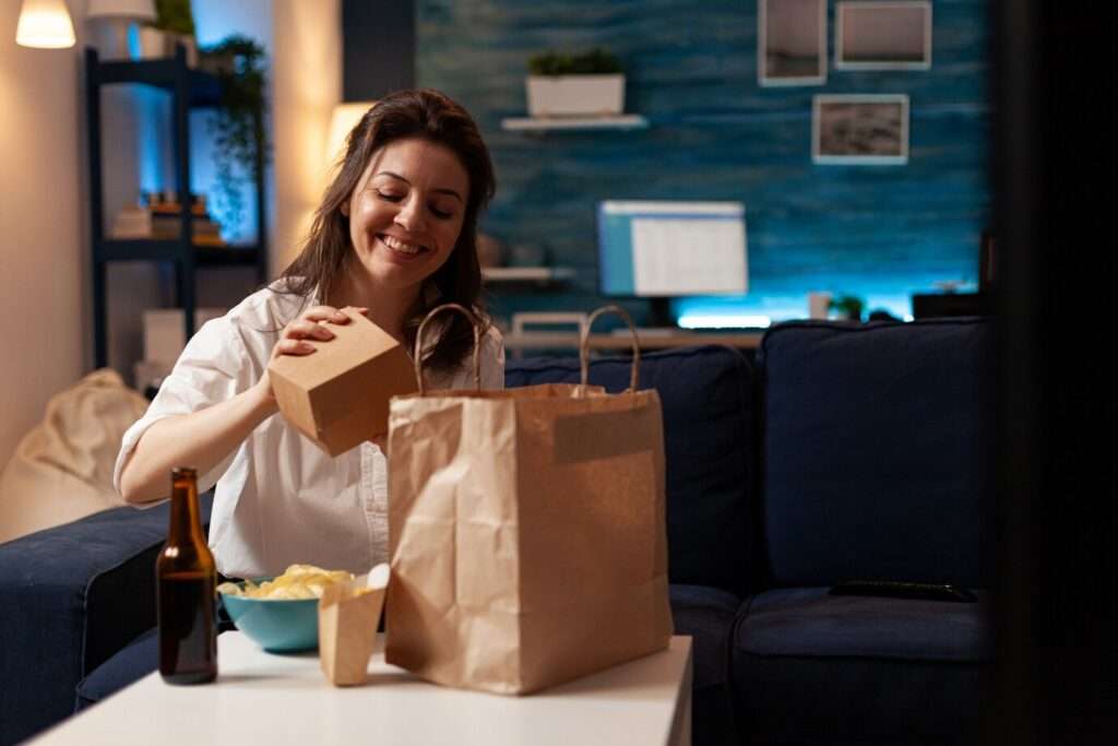 Happy Lady Checking Her Delievry - Route Scheduling Software